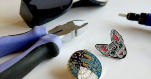 Create a needle minder from an enamel pin