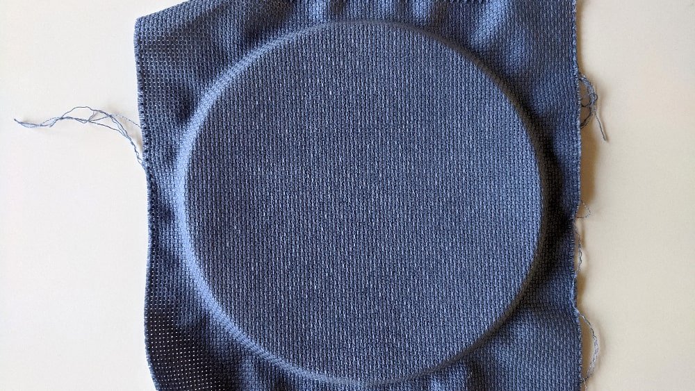 Place the fabric over the inner hoop
