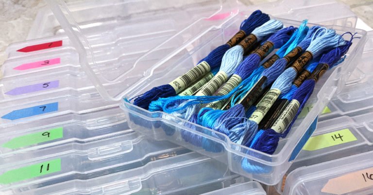 Organize floss in plastic photo storage containers.