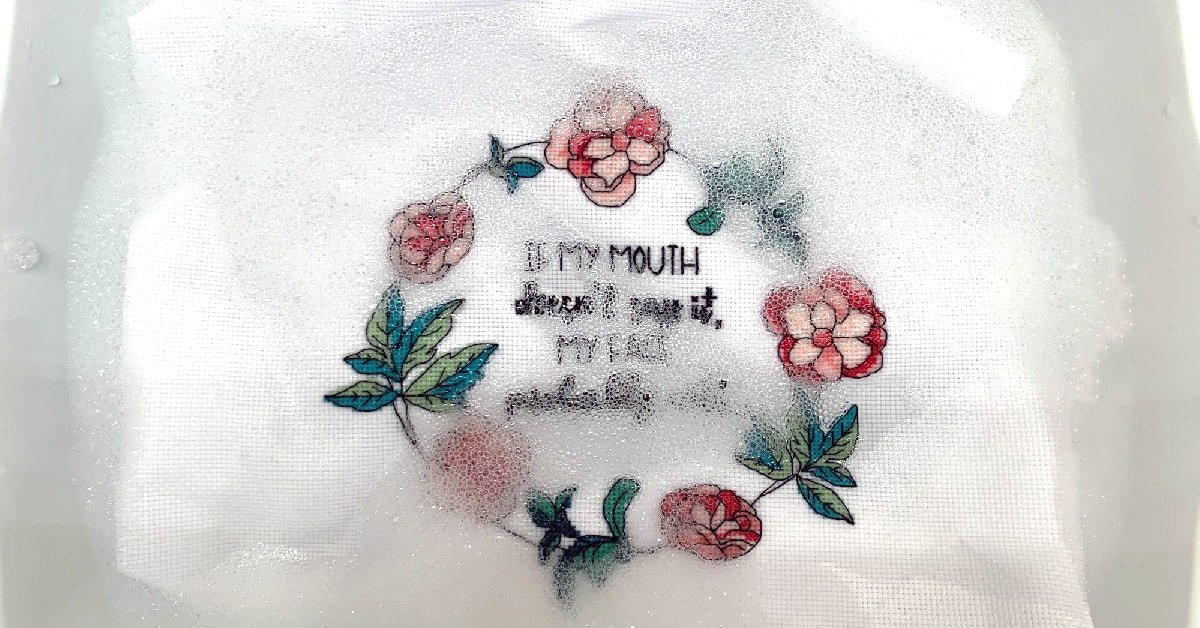 Wash your cross stitch to remove dirt and oils