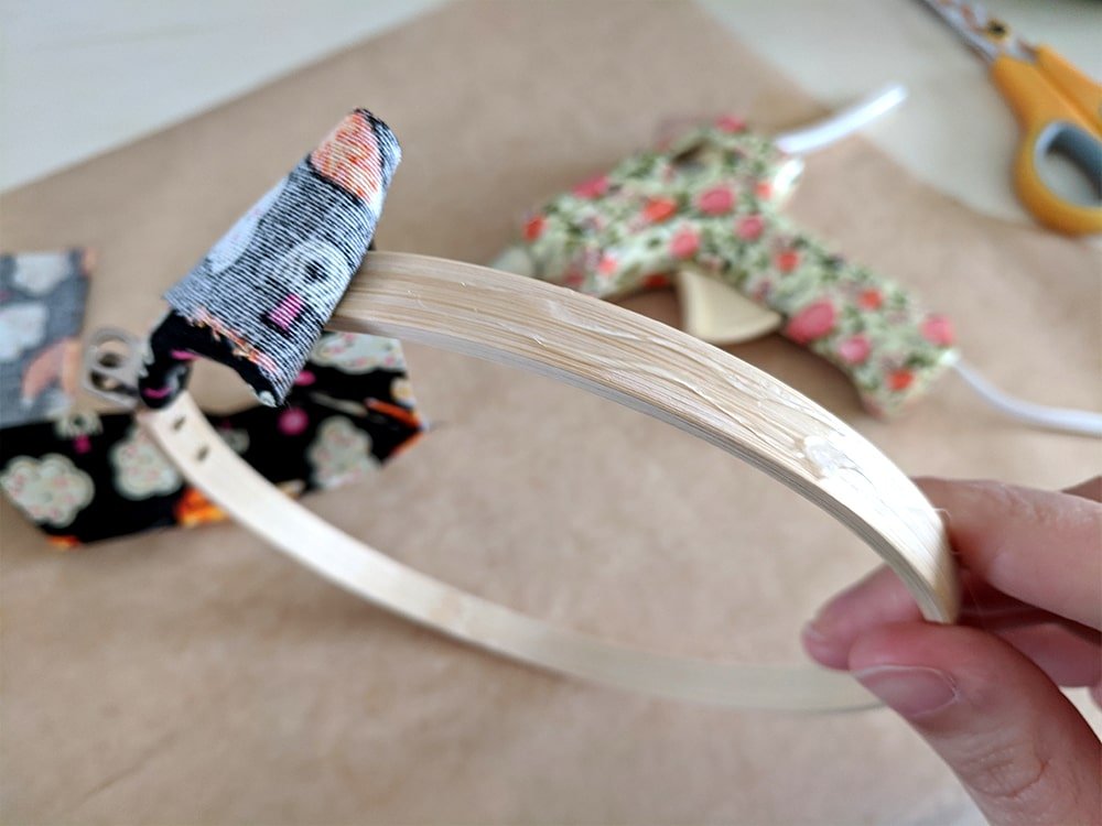 Add more glue as you work your way around the hoop